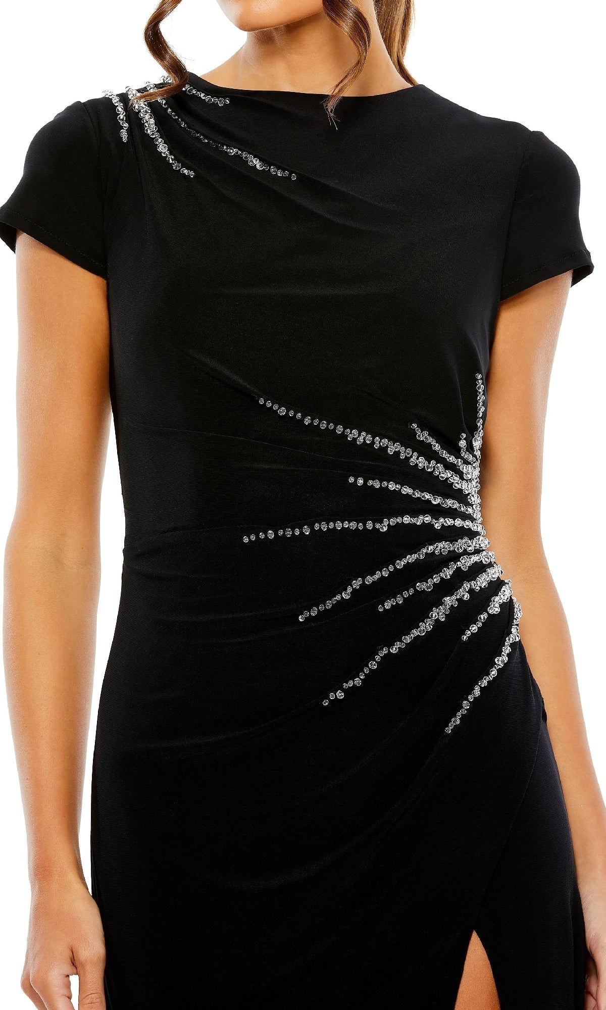 A woman wears the Mac Duggal 11670 short sleeve black formal dress, featuring silver bead embellishments radiating from the waist and shoulder.